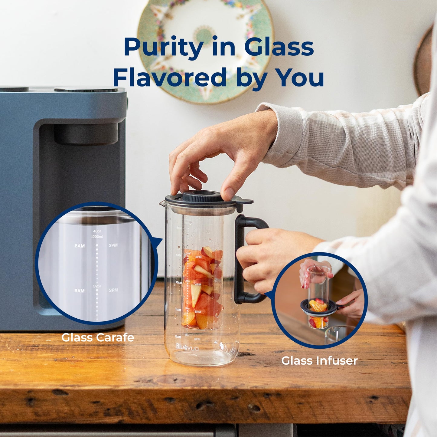 Person using a glass carafe and infuser with text 'Purity in Glass Flavored by You' on a wooden table.