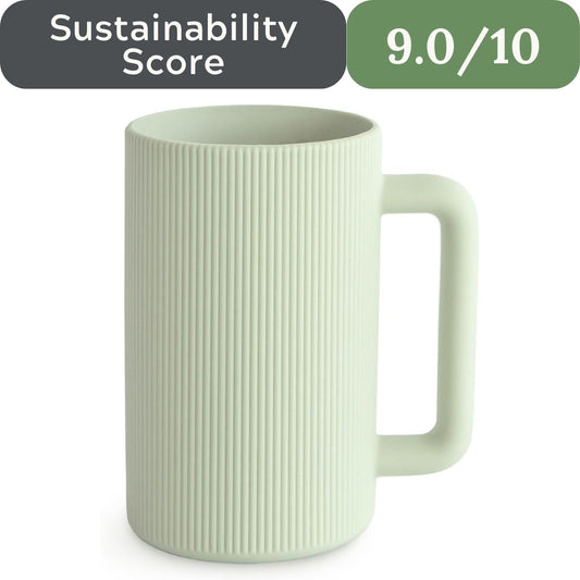 Green mug with ribbed texture on a white background, sustainability score displayed.