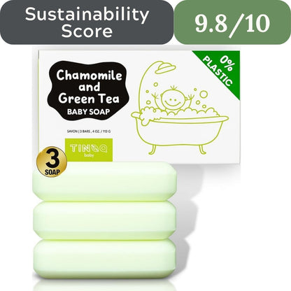 Three bars of chamomile and green tea baby soap with packaging displaying sustainability information.